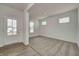 Living room boasts an entryway and neutral gray carpet, providing a cozy feel at 7501 Firecrest Ln, Camby, IN 46113