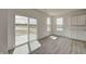 Bright living area with sliding glass doors leading to a patio and views of a tranquil lake at 7501 Firecrest Ln, Camby, IN 46113