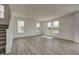 The home boasts an open living area with windows overlooking the pond and a staircase to the second floor at 7501 Firecrest Ln, Camby, IN 46113