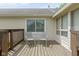 Cozy outdoor porch featuring a wood-plank deck and two chairs at 786 Woodview North Dr, Carmel, IN 46032