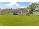 Lush backyard featuring a well-kept lawn and adjacent outdoor patio at 786 Woodview North Dr, Carmel, IN 46032