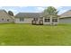 Expansive backyard with well-maintained lawn and charming deck area at 786 Woodview North Dr, Carmel, IN 46032