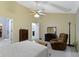Spacious bedroom featuring a ceiling fan, natural light, and neutral carpet at 786 Woodview North Dr, Carmel, IN 46032