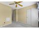 Neutral bedroom featuring a ceiling fan, closet, and adjacent doorway at 786 Woodview North Dr, Carmel, IN 46032