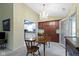 Bright dining area features elegant chandelier lighting, wood furnishings, and seamless flow to the adjacent kitchen at 786 Woodview North Dr, Carmel, IN 46032