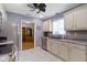Well-lit kitchen features modern appliances, granite countertops, tile flooring, and a neutral color palette at 786 Woodview North Dr, Carmel, IN 46032