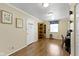 A bright living room featuring hardwood floors, natural lighting and neutral colored walls at 786 Woodview North Dr, Carmel, IN 46032