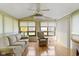 Bright sunroom with natural light, ceiling fan, and comfortable furniture, perfect for relaxation at 786 Woodview North Dr, Carmel, IN 46032