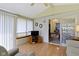 Cozy sunroom featuring a TV, chandelier view, and comfortable seating area for relaxing at 786 Woodview North Dr, Carmel, IN 46032