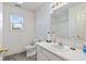 Bright bathroom features white fixtures, a vanity with a sink, and a shower-tub combo at 8038 Midlothian Way, Indianapolis, IN 46214