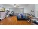 Spacious bedroom with hardwood floors, ceiling fan, and windows for natural light at 8038 Midlothian Way, Indianapolis, IN 46214
