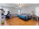 Bright bedroom with hardwood floors, natural light, and ample space at 8038 Midlothian Way, Indianapolis, IN 46214