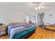 Bedroom with hardwood floors, ceiling fan, and a comfortable bed at 8038 Midlothian Way, Indianapolis, IN 46214
