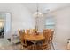 Comfortable dining room features wood table, chandelier, and a window at 8038 Midlothian Way, Indianapolis, IN 46214