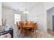 Bright dining room showcases table with seating and an elegant chandelier at 8038 Midlothian Way, Indianapolis, IN 46214