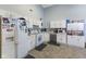 Bright kitchen featuring white cabinets, stainless steel appliances, and tile flooring at 8038 Midlothian Way, Indianapolis, IN 46214