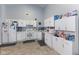 Spacious kitchen with white cabinetry, stainless appliances, and ample counter space at 8038 Midlothian Way, Indianapolis, IN 46214
