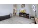 Cozy living room featuring modern floors and entertainment center with fireplace at 8038 Midlothian Way, Indianapolis, IN 46214