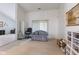 Open living room with sliding glass doors, wood floors, and seating area at 8038 Midlothian Way, Indianapolis, IN 46214