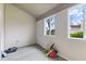 Enclosed patio with a view of the backyard, showcasing a door to the outside and natural light at 8038 Midlothian Way, Indianapolis, IN 46214