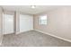 Bedroom featuring plush carpeting, a double closet, and neutral paint at 823 Rustic Rd, Anderson, IN 46013
