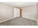 Bedroom featuring carpeting, neutral walls, closet, and lighting at 823 Rustic Rd, Anderson, IN 46013