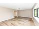 Expansive living room showcasing stylish flooring, ample natural light, and seamless flow to adjacent spaces at 823 Rustic Rd, Anderson, IN 46013