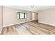 Bright living room featuring sleek hardwood floors, a large bay window, and neutral wall colors at 823 Rustic Rd, Anderson, IN 46013