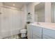 This bright bathroom features a shower with curtain, double sink vanity, and modern fixtures at 853 Woodbridge Way, Lebanon, IN 46052