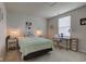 This comfortable bedroom has a bed, nightstand, desk, and a window for natural light at 853 Woodbridge Way, Lebanon, IN 46052