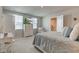This bedroom is complete with a dresser, TV, and a comfortable chair at 853 Woodbridge Way, Lebanon, IN 46052