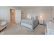 This cozy bedroom features a comfortable bed, a nightstand, and an open doorway at 853 Woodbridge Way, Lebanon, IN 46052