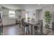 Bright dining area featuring a wooden table, stainless steel appliances, and ample counter space, ideal for Gathering meals at 853 Woodbridge Way, Lebanon, IN 46052
