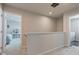 Upstairs hallway with a view of the bedrooms and laundry room at 853 Woodbridge Way, Lebanon, IN 46052