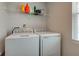 This laundry room features a washer and dryer, providing convenience and efficiency for household chores at 853 Woodbridge Way, Lebanon, IN 46052