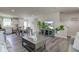 Spacious living area with modern furniture, a dining set, and a glimpse of the kitchen, perfect for Gathering gatherings at 853 Woodbridge Way, Lebanon, IN 46052