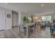 Open floor plan features a living room, dining area and an entry with contemporary finishes and neutral colors at 853 Woodbridge Way, Lebanon, IN 46052