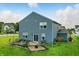 Two-story home featuring a spacious backyard with patio, outdoor seating and string lights at 8547 Winton Pl, Pendleton, IN 46064