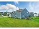 Expansive backyard showcasing a well-maintained lawn and a patio, ideal for outdoor gatherings and relaxation at 8547 Winton Pl, Pendleton, IN 46064