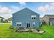 Aerial view showcasing the home's backyard, landscaped patio, and the surrounding neighborhood at 8547 Winton Pl, Pendleton, IN 46064