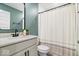 Bathroom with large vanity, white cabinets, granite counter, and shower-tub combo at 8547 Winton Pl, Pendleton, IN 46064