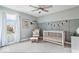 Cozy Bedroom with neutral walls, decorative paneling, and comfortable seating at 8547 Winton Pl, Pendleton, IN 46064
