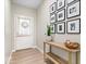 Inviting entryway with light wood floors, console table, and decor creating a welcoming ambiance at 8547 Winton Pl, Pendleton, IN 46064