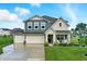 Charming two-story home with three-car garage and beautiful landscaping, perfect for curb appeal at 8547 Winton Pl, Pendleton, IN 46064