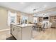 Open-concept kitchen features granite countertops and island seating with an adjacent dining area at 8547 Winton Pl, Pendleton, IN 46064
