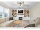 Inviting living room with a cozy fireplace, built-in shelving, and comfortable seating perfect for relaxing at 8547 Winton Pl, Pendleton, IN 46064