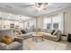 Spacious living room with a large sectional sofa and abundant natural light from large windows at 8547 Winton Pl, Pendleton, IN 46064