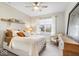 Serene main bedroom featuring neutral tones, a ceiling fan, and large window for natural light at 8547 Winton Pl, Pendleton, IN 46064