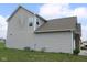 A home's back exterior showcasing vinyl siding and a well-maintained lawn at 9068 Thames Dr, Avon, IN 46123