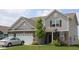 Charming two-story home featuring vinyl siding, brick accents, and an attached two-car garage at 9068 Thames Dr, Avon, IN 46123